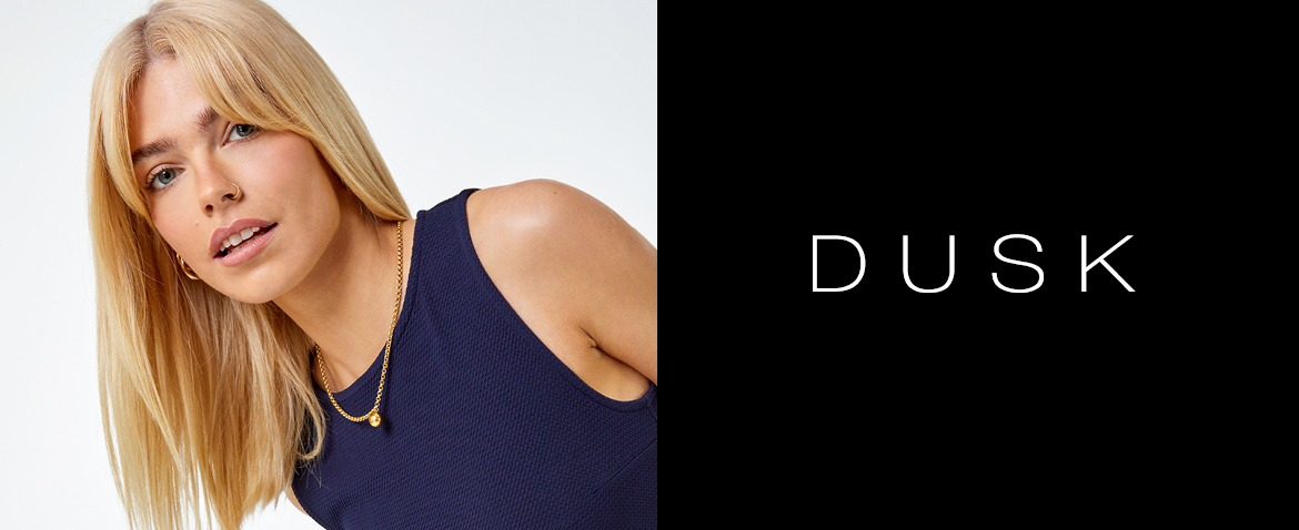 Woman modelling Dusk clothing and the Dusk logo