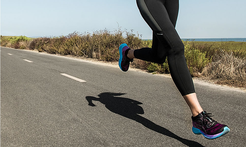 Woman running with Asics shoes on